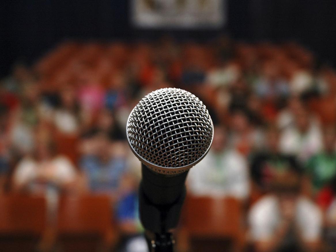 Microphone in front of a large audience