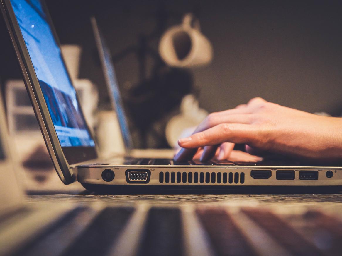 Fingers typing on a keyboard