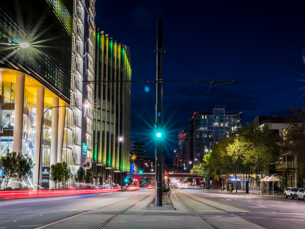 night time shot of north terrace tram line, outside Adelaide Health and Medical Sciences building and UniSA building
