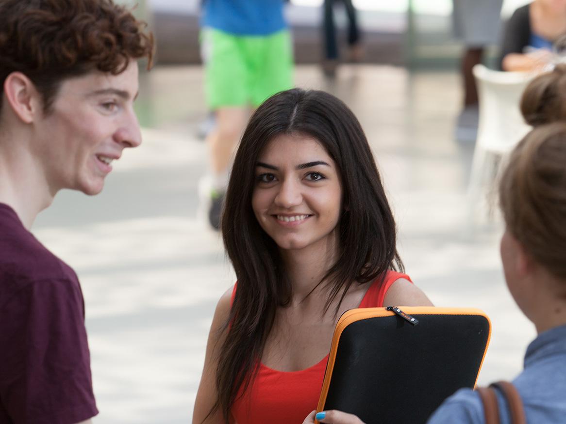 Students talking and smiling