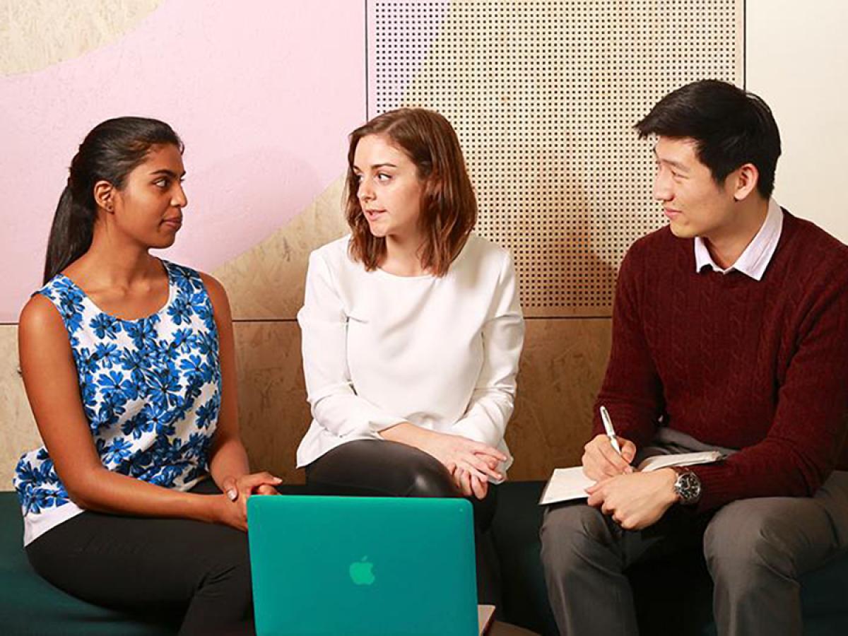 Three students having a discussion