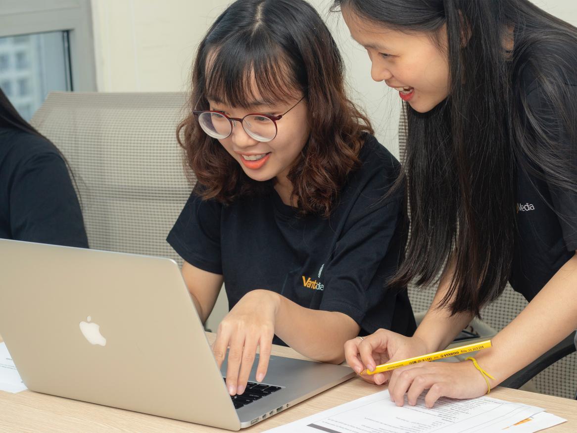 Image of two girls on a laptop