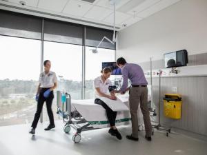 Students taking each other's blood pressure in Adelaide Health Simulation clinical room