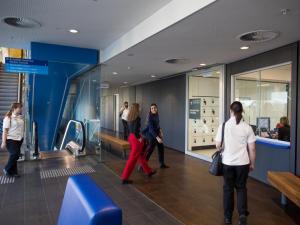 Students and staff walking through the foyer at the entrance of the Adelaide Health Simulation
