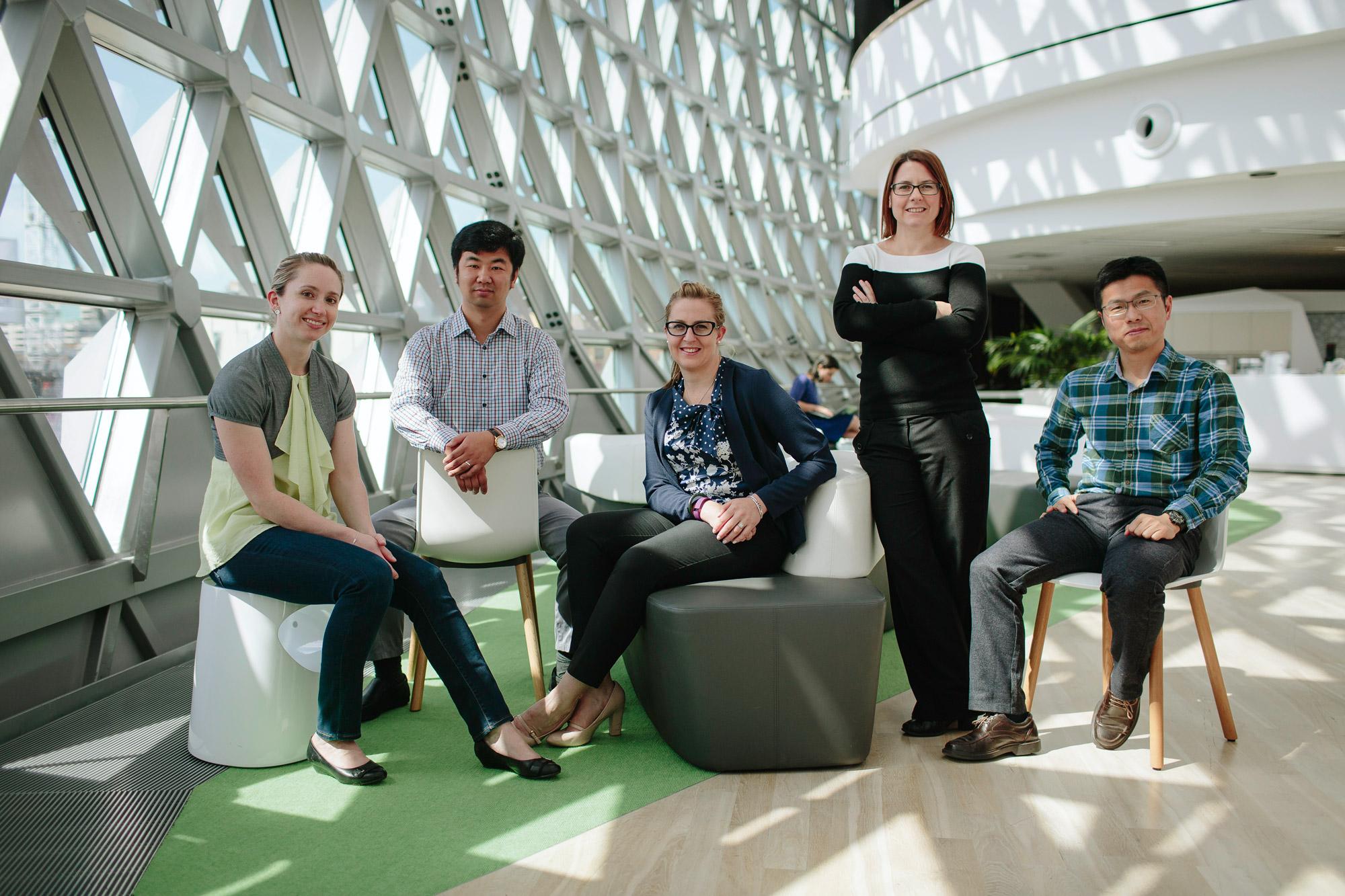 Leonie Heilbronn with her research group, inside SAHMRI