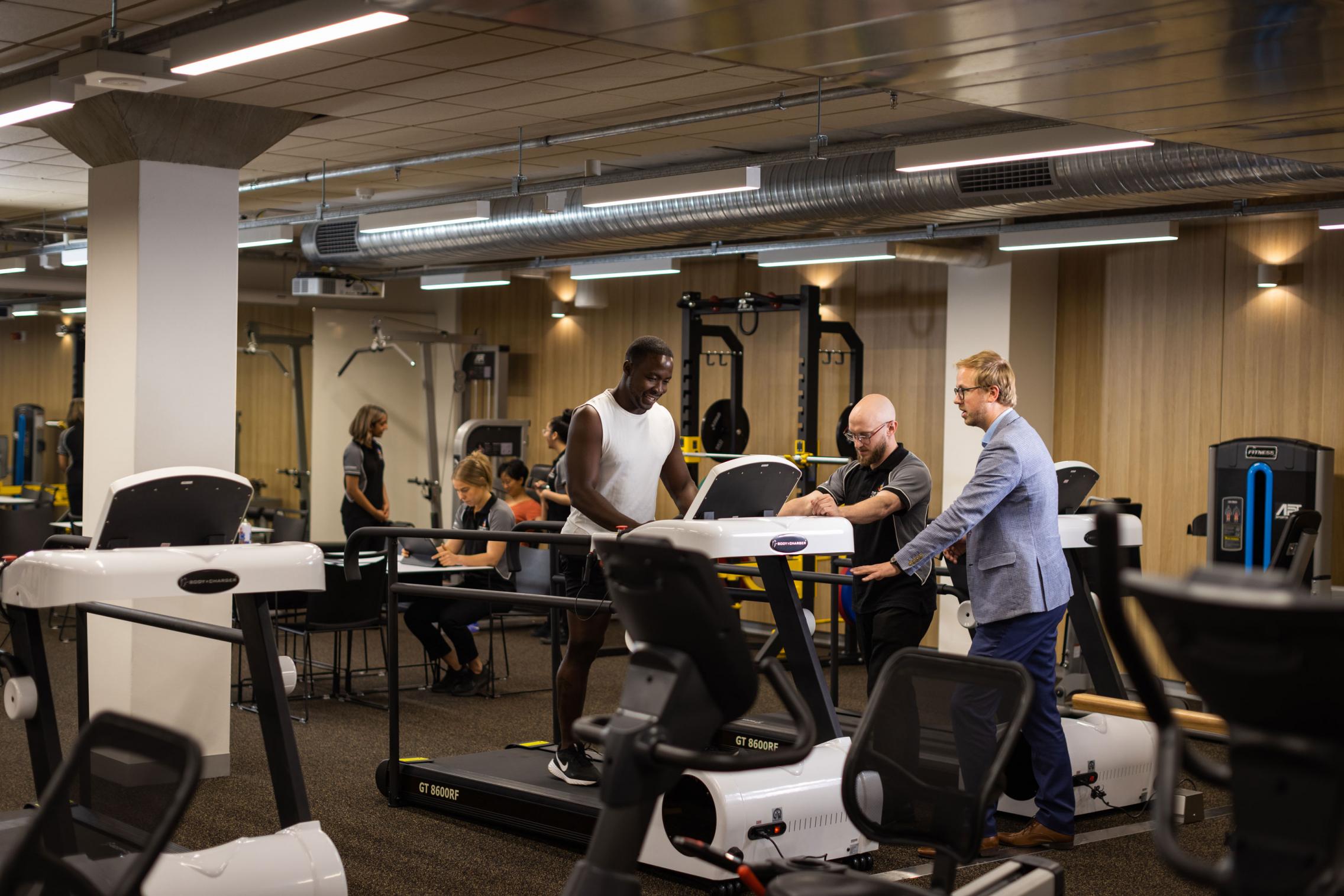 Image of man on treadmill in rehab gym
