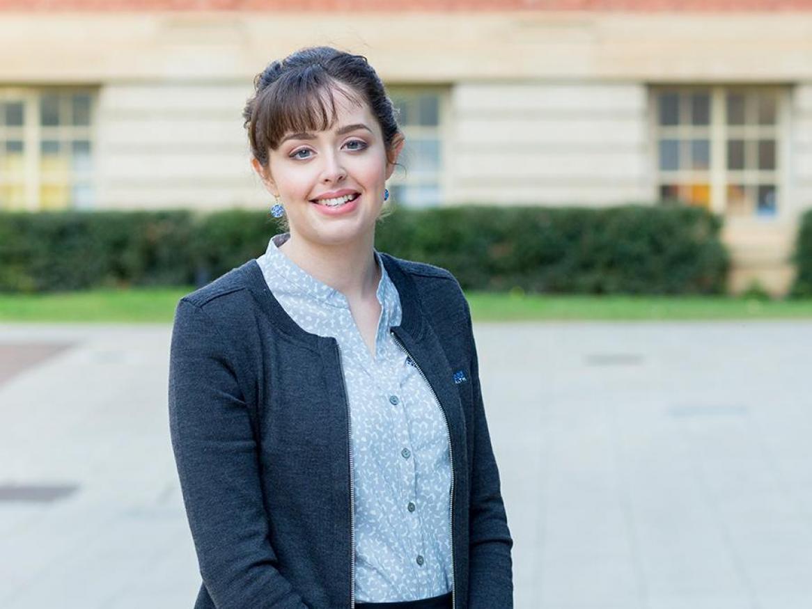 Portrait of Candace Bavaresco standing in front of Barr Smith Library