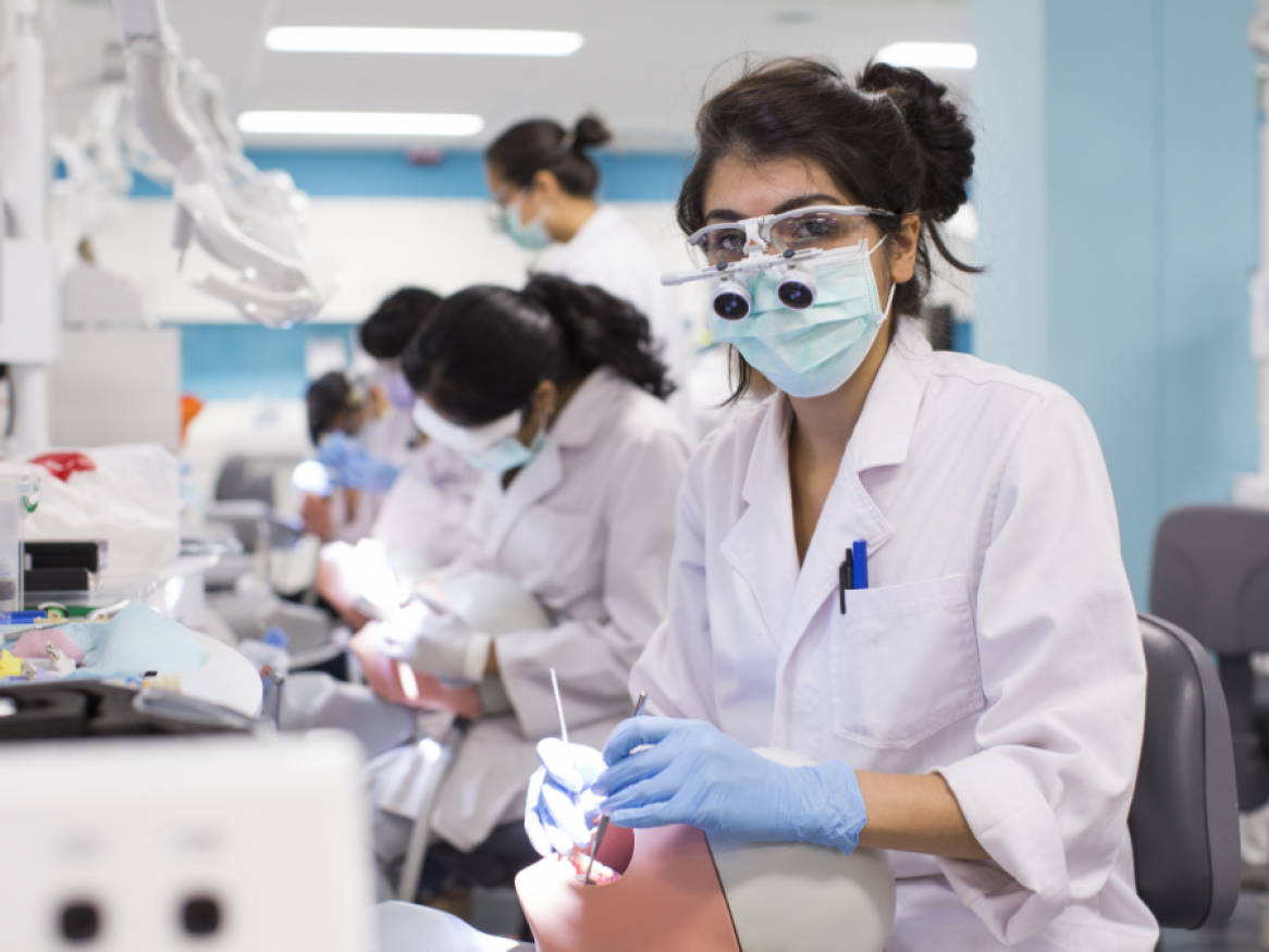 Female dentistry student in dental simulation lab