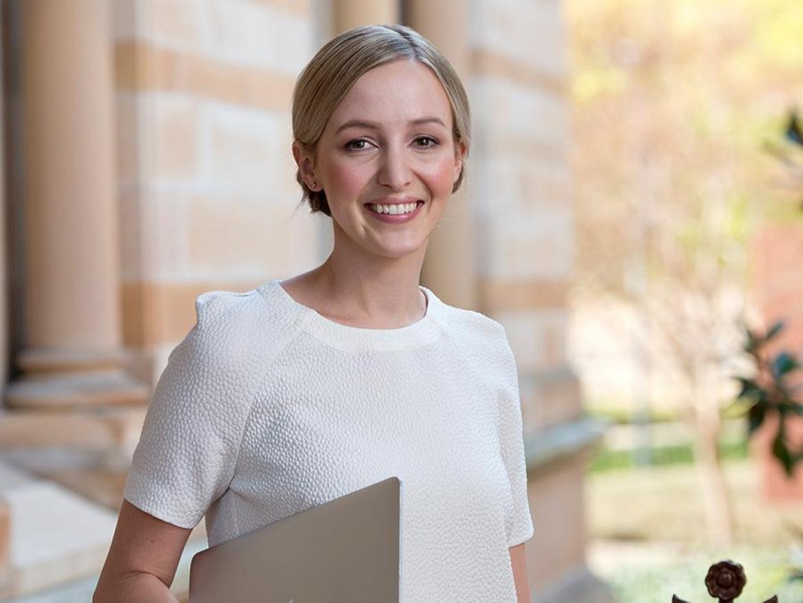 Portrait of Elena Hotinski standing next to Barr Smith Library