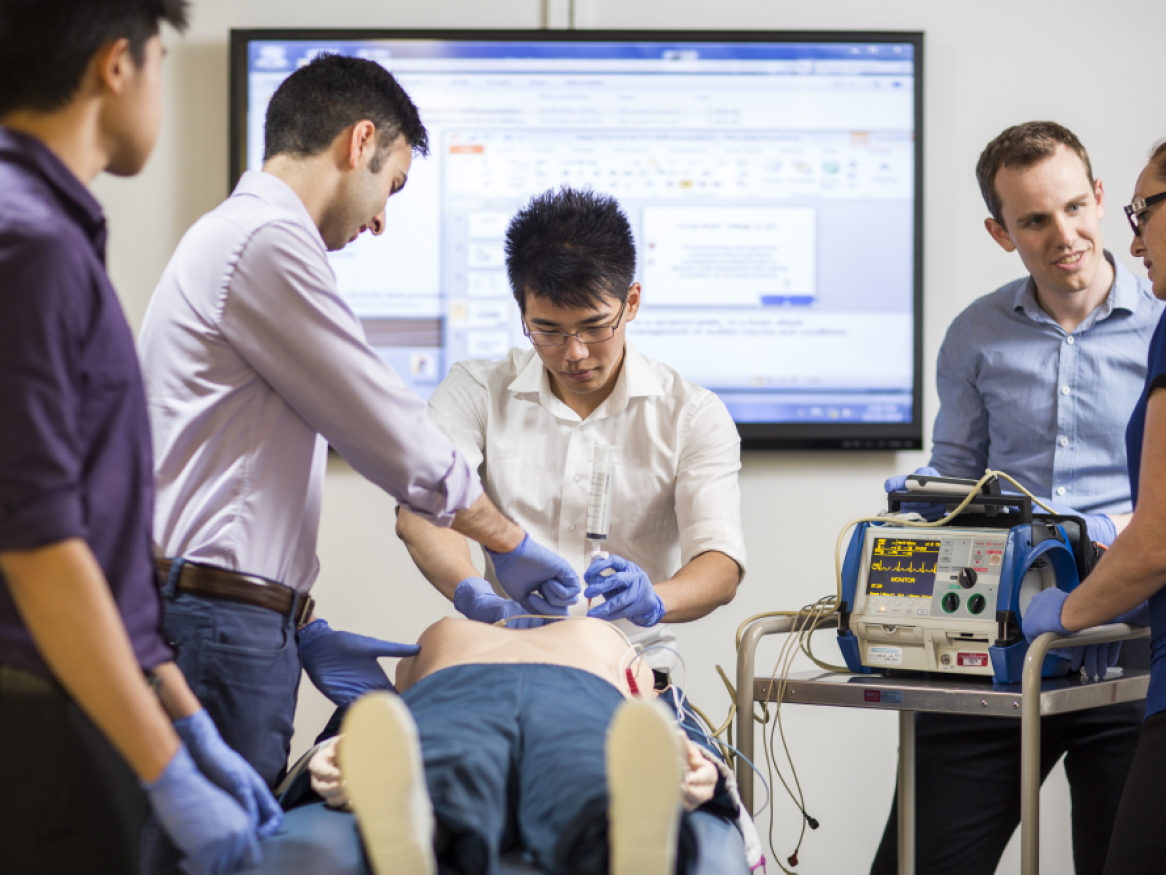 Students intubating simulated patient