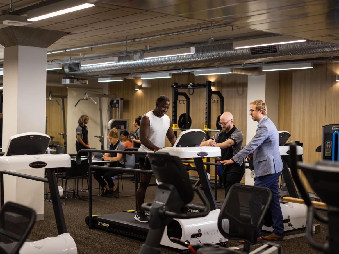 Image of man on treadmill in rehab gym